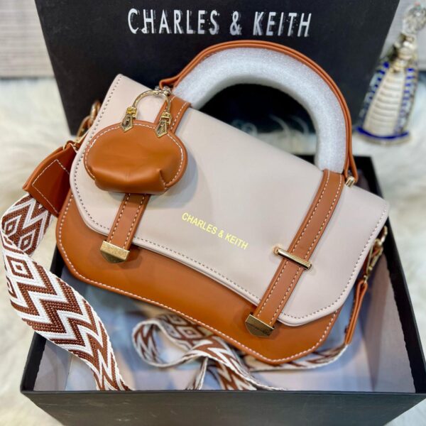 C&K branded crossbody bag for girls in soft material with stylish keychain